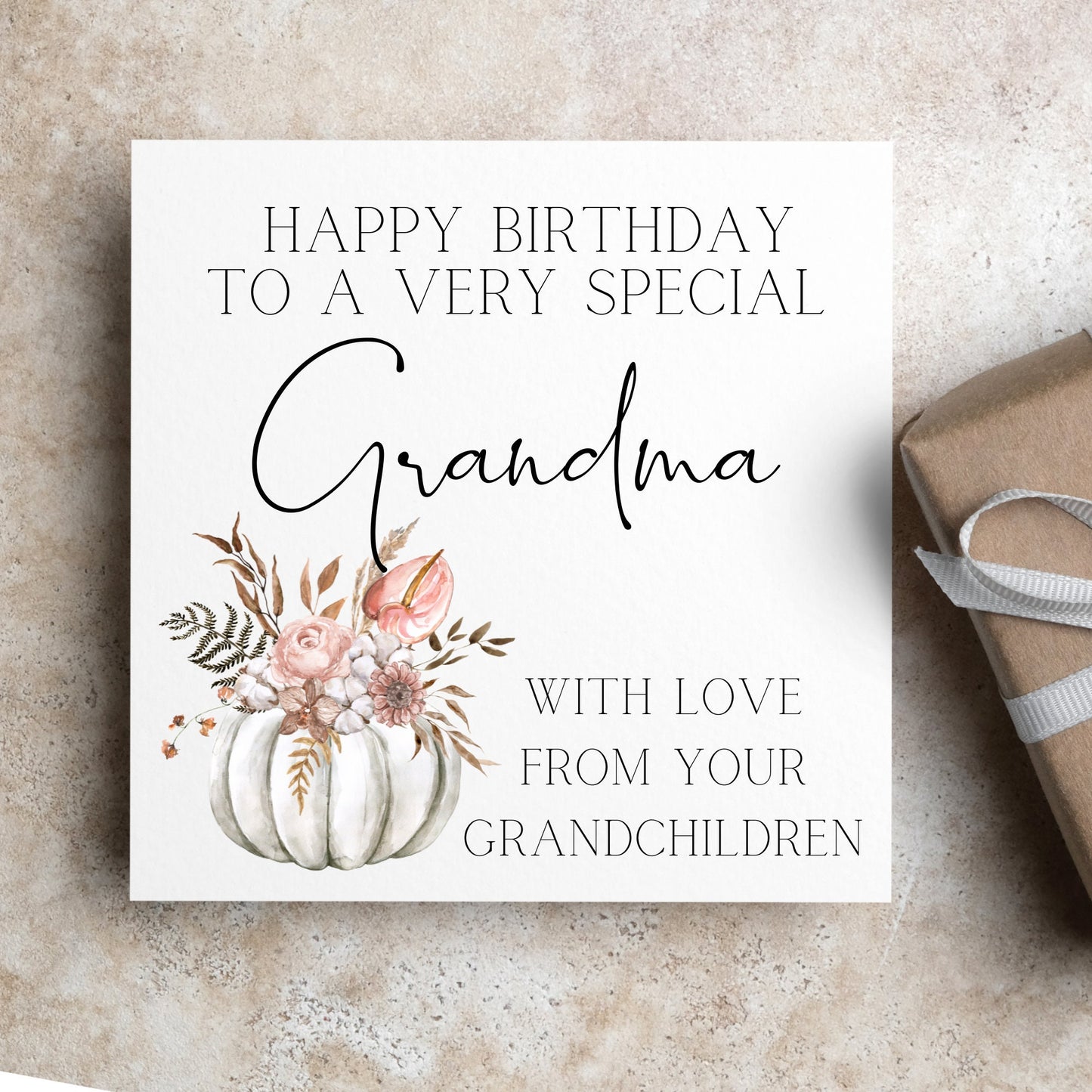 Happy birthday to a special grandma from grandchildren card, white pumpkin and flowers for a fall / autumn birthday